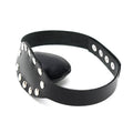 Rimba leather muzzle with studs, featuring a secure design and stylish detailing for pet restraint.