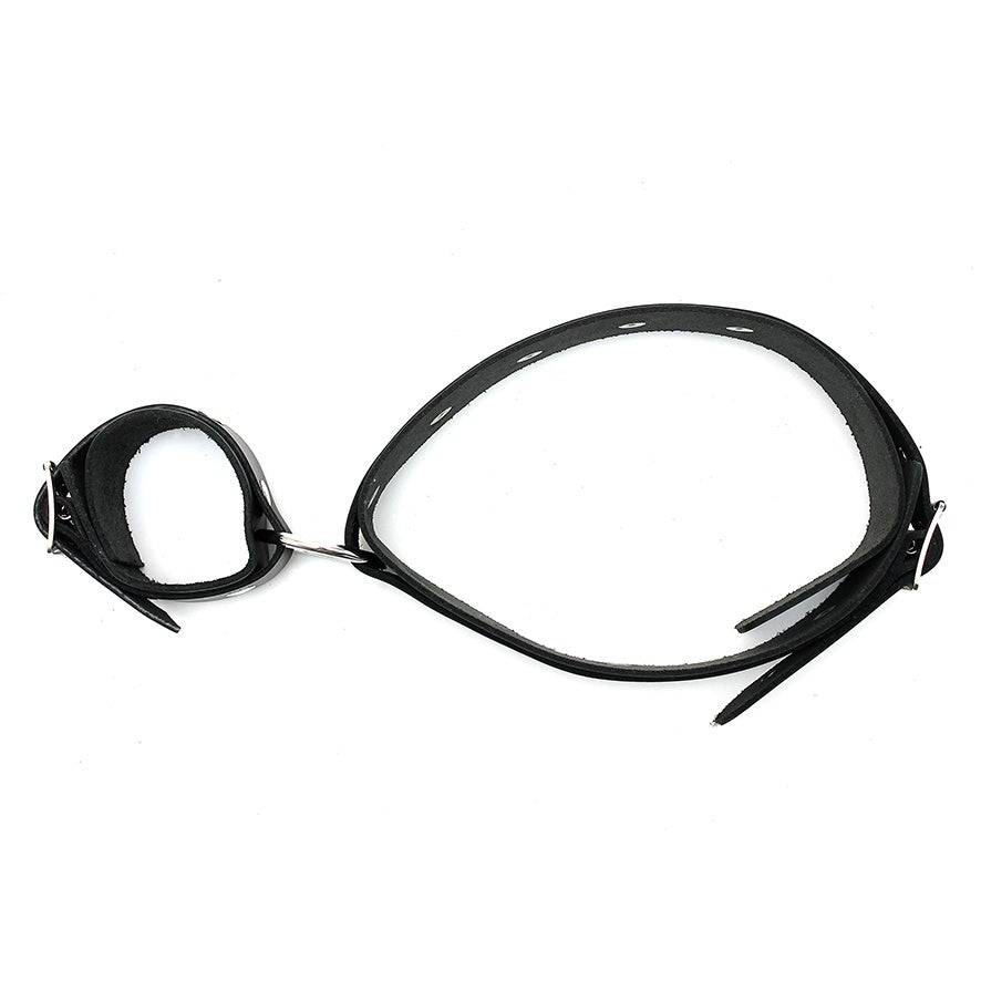 Rimba leather wrist and ankle cuffs with sturdy handles, showcasing a sleek design and durable craftsmanship.