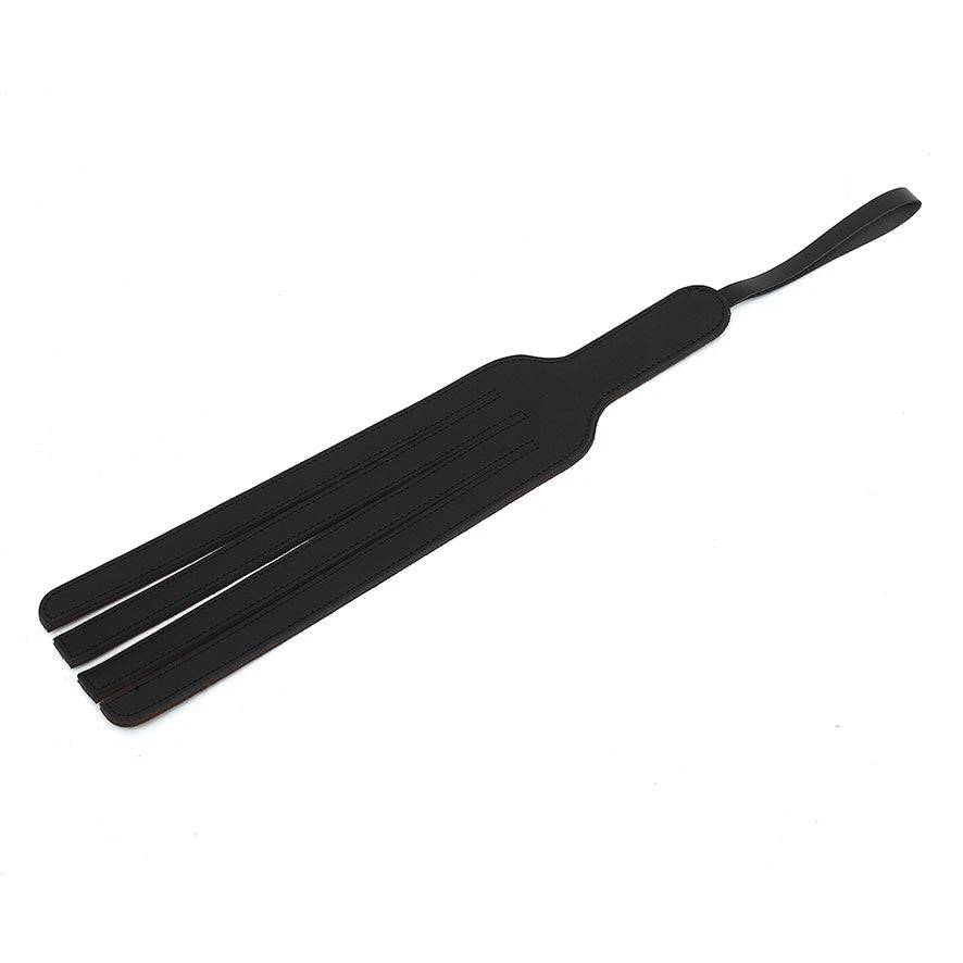 Rimba leather gaffel-shaped paddle with smooth finish and sturdy handle, perfect for versatile use.