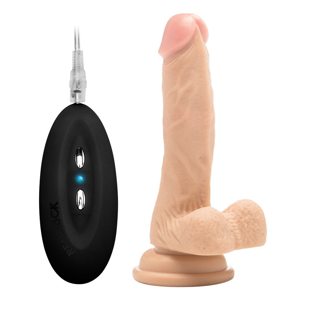 RealRock 7-inch vibrating realistic dildo with scrotum by Shots Toys, featuring lifelike details and textured surface.