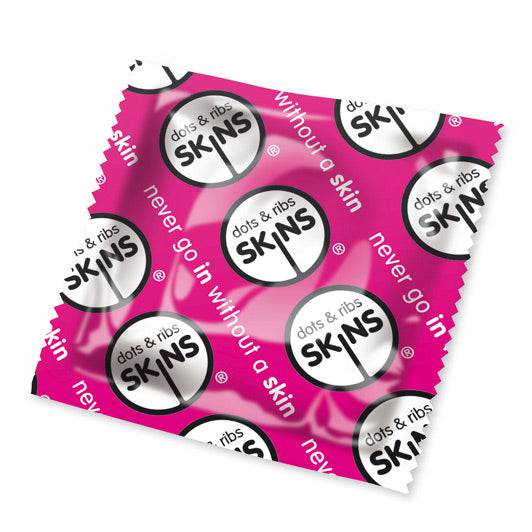 Skins Condoms pink ribbed and dotted condoms in a pack of 50, showcasing texture and vibrant color.