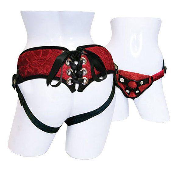 SportSheets red lace and satin corsette strap-on with adjustable straps and intricate detailing displayed on a neutral background.