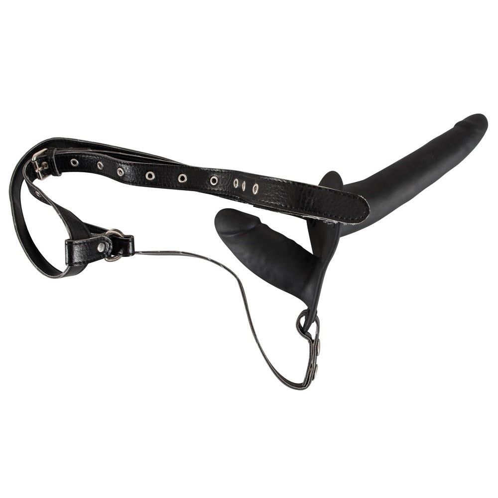 Black double-ended dildo strap-on by You2Toys on a neutral background, showcasing its sleek design and flexible shape.